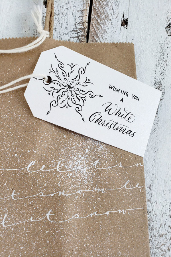 let it snow gift bag lettering closeup with tag