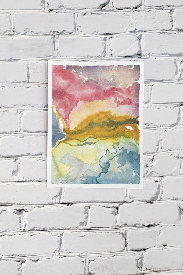 Stormy marbled watercolor abstract on a white brick wall