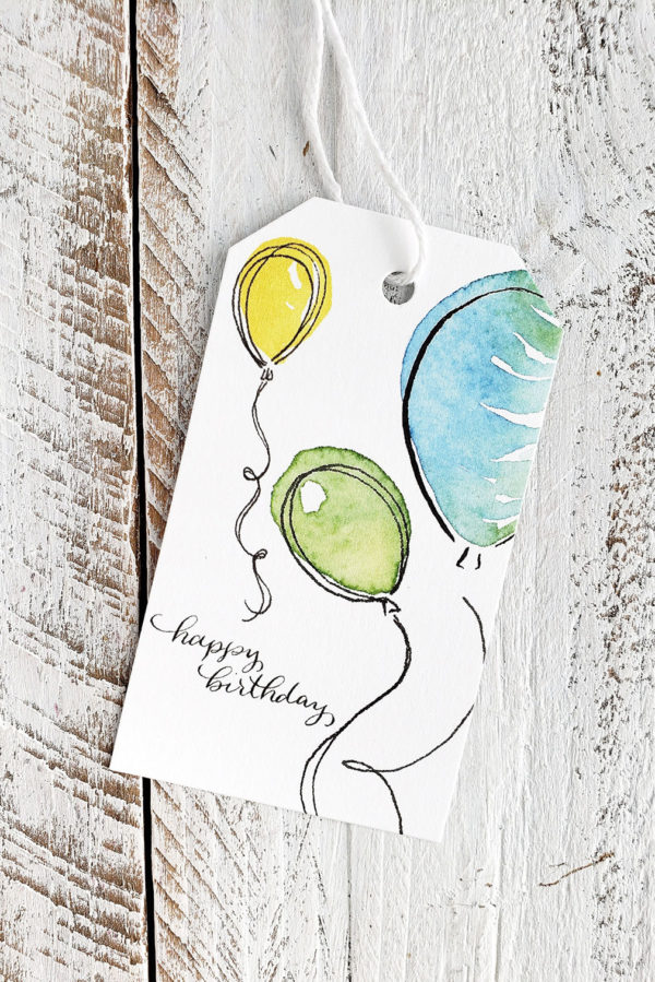 Birthday balloon gift tags with three balloons closeup