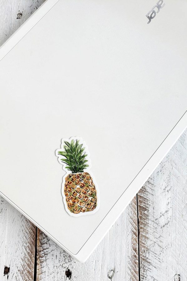 pineapple sticker on a laptop