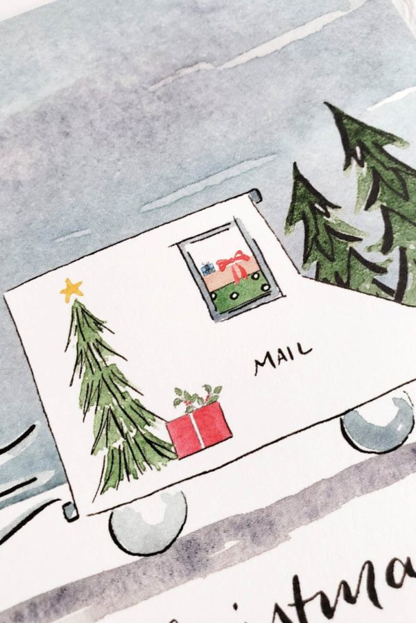 packages in an illustrated mail truck at Christmas