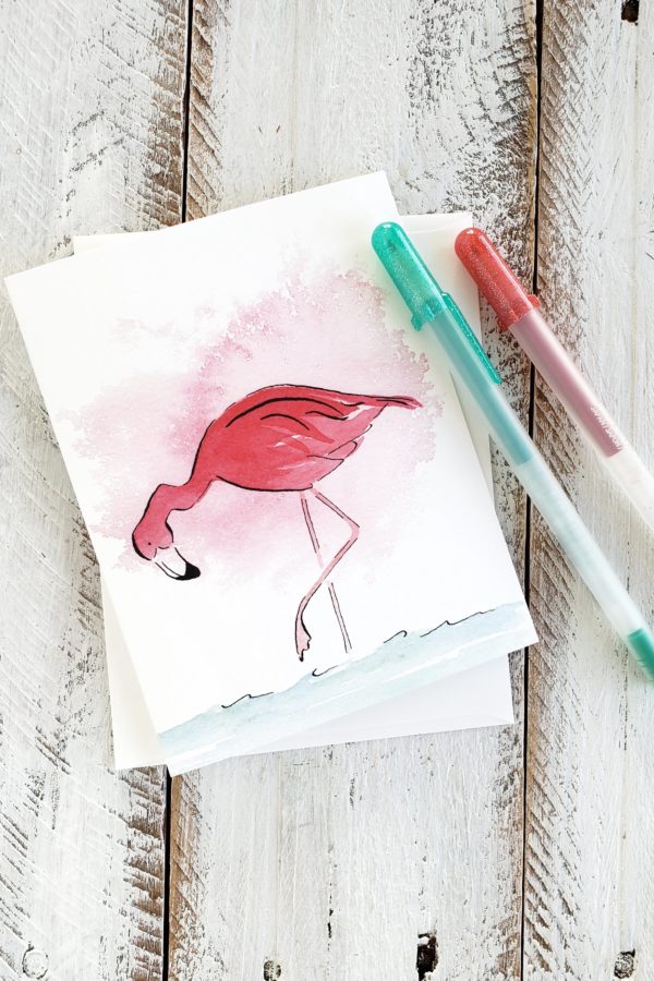 flamingo looking for food watercolor greeting card with gel pens