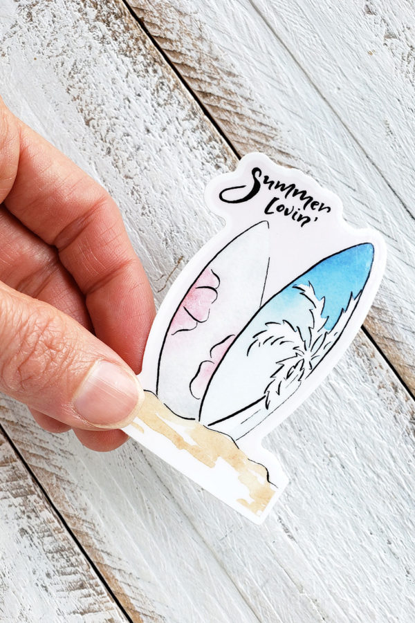 summer lovin' surfboard sticker held