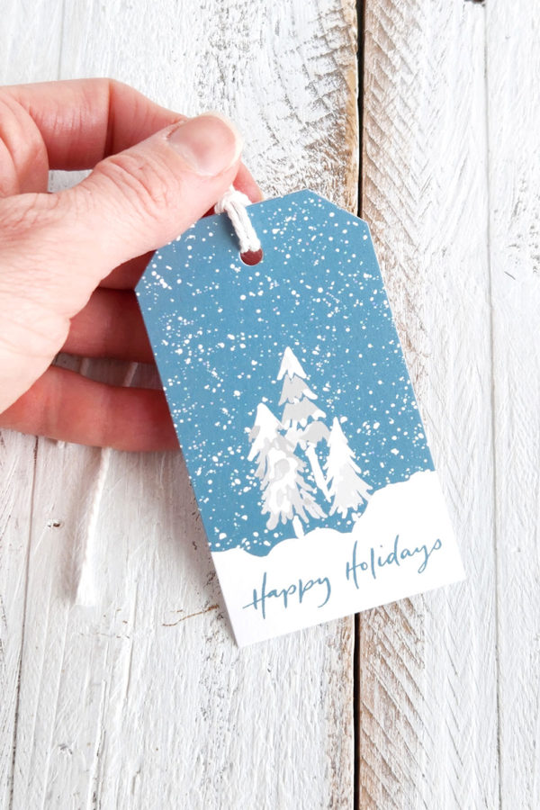 happy holidays snowy trees gift tag