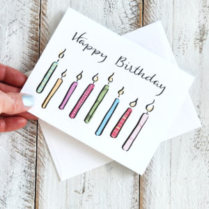 Happy Birthday candles card held