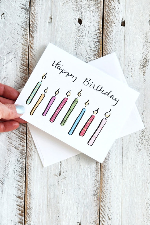 Happy Birthday candles card held