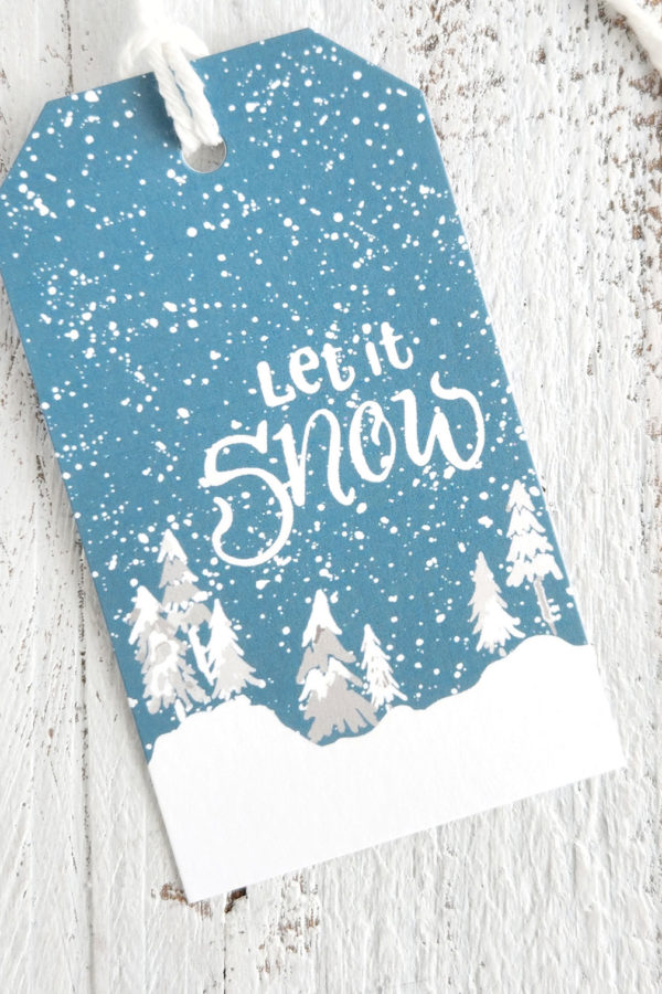 Snowy trees gift tag with let it snow lettering