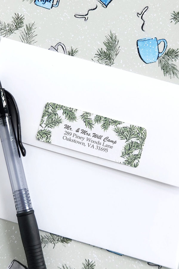 wreath return address label pictured on an envelope close